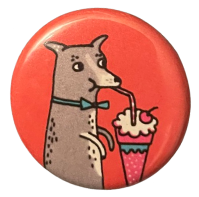 a red pin with a gray dog that has a blue bowtie on & is drinking a milkshake