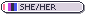 Tiny button with the genderfluid flag that says she/her