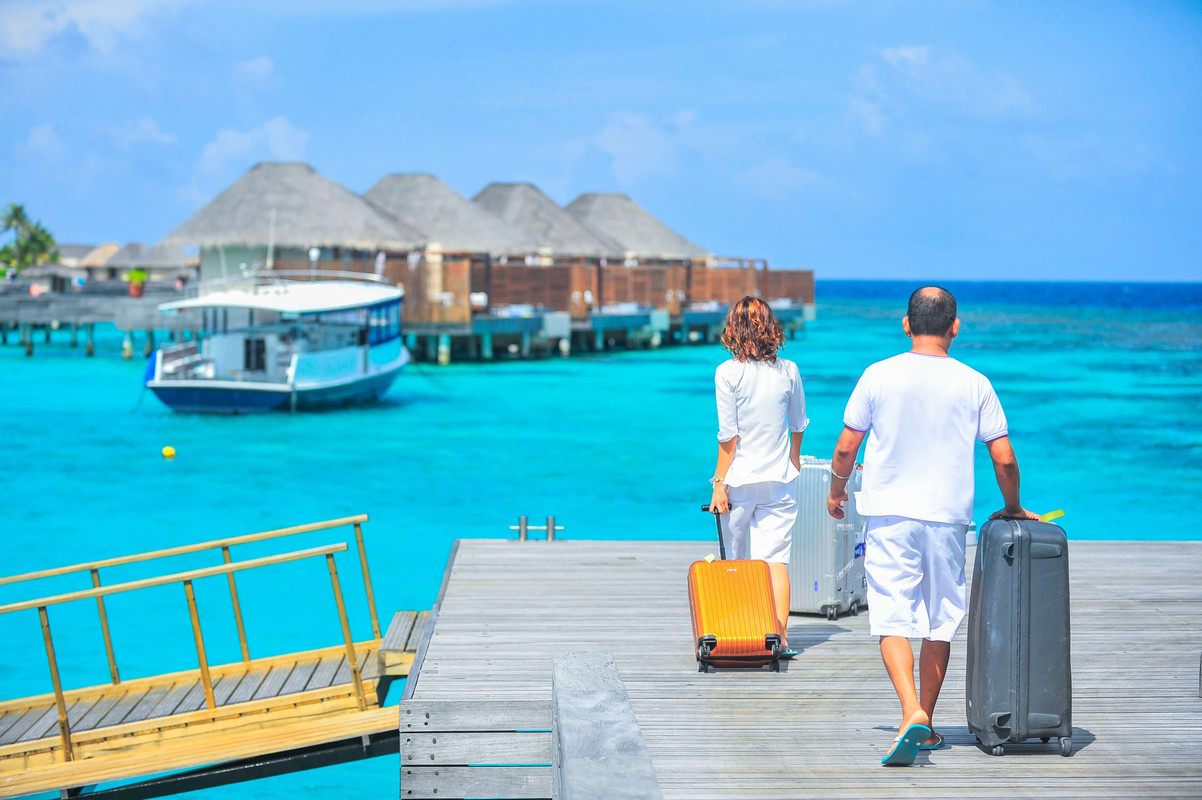 Guests with luggage at resort