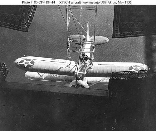 https://i.postimg.cc/Pr5njWH4/500px-XF9-C-1-aircraft-hooking-onto-USS-Akron-May-1932.jpg