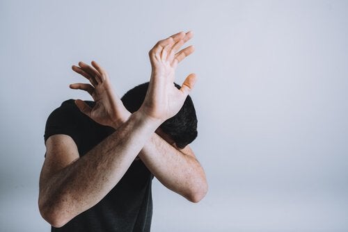 fearful-man-with-rejecting-arms.jpg