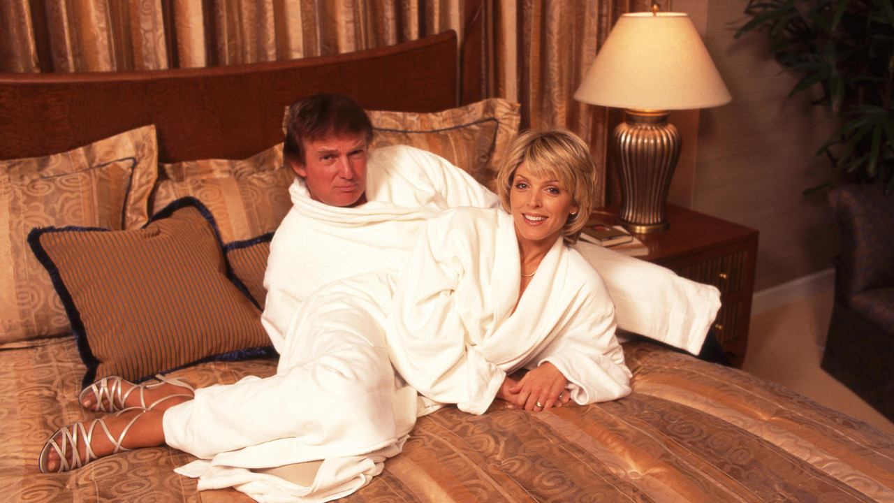 Donald Trump and his ex-wife Marla Maples both in a white bathrobe.