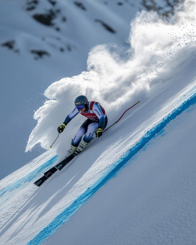 A photorealistic 4K DSLR shot of a ski jumper soaring through the air against a crisp winter sky ca