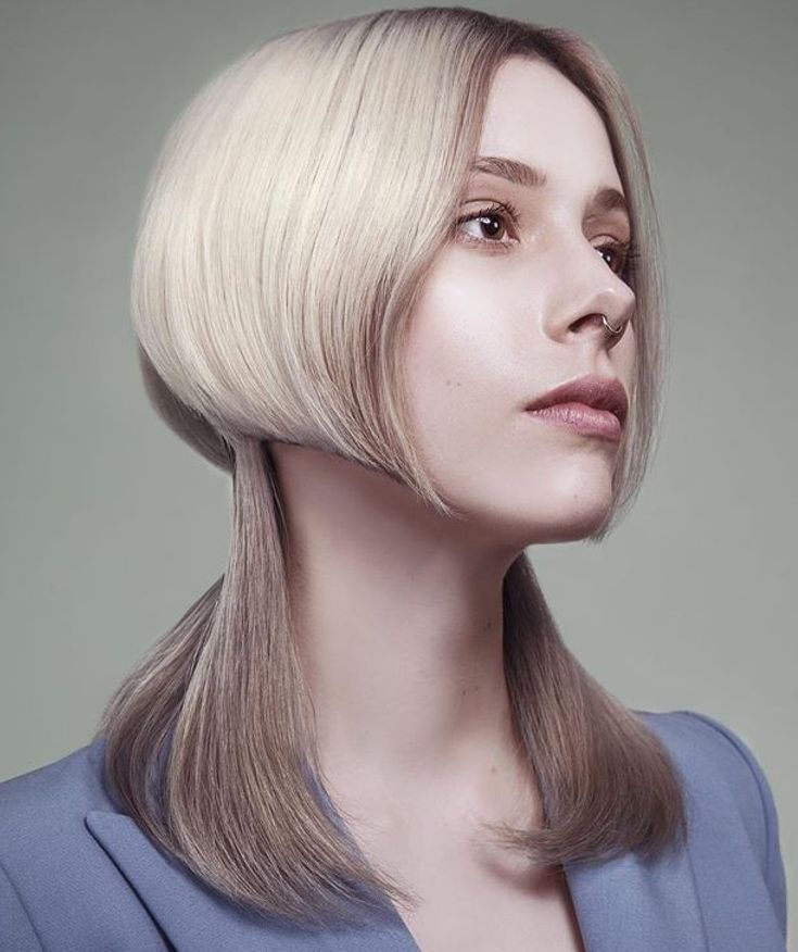 Layered cut with a fringe that falls just below the chin