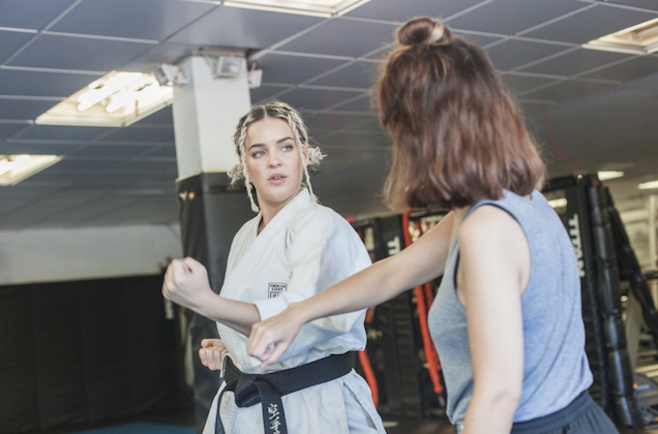 Anne is a karate player holding black belt