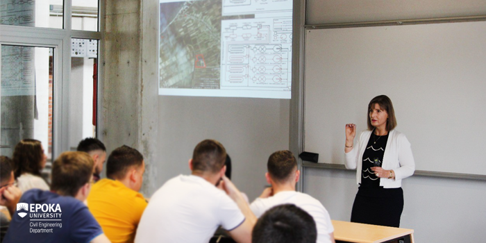 Professor Gjinali teaching to a room of students at Epoka University