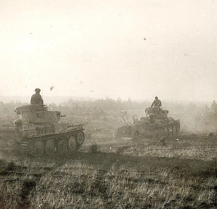 BEST German Pzkw 38(t) Panzer Tank Column Passing Stopped Tanks in Field
