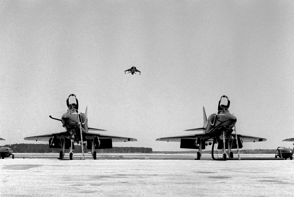 two-a-4-skyhawk-blue-angel-aircraft-are-sitting-on-the-flight-line-as-an-av-ec4634.jpg
