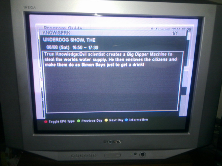 EPG for The Underdog Show showing an episode-specific synopsis: 'Evil scientist creates a Big Dipper Machine to steal the world water supply. He then enslaves the citizens and make them do as Simon Says just to get a drink'