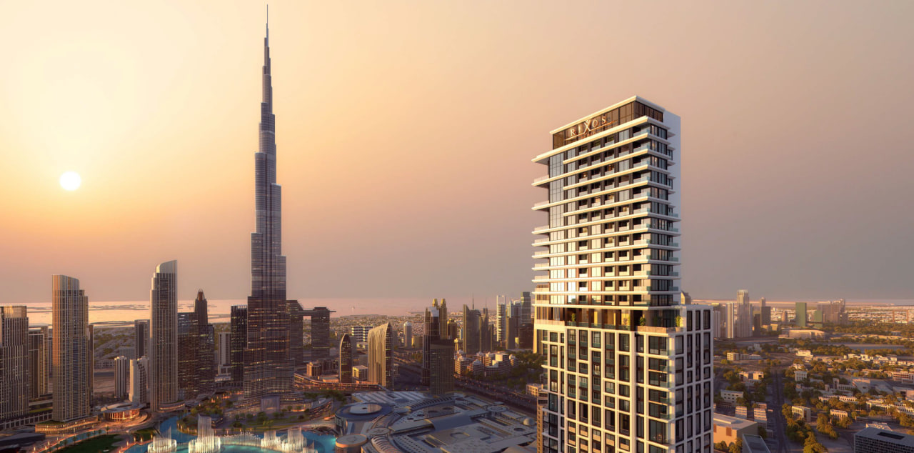 Rixos FCR Distress Deal luxury waterfront tower in Downtown Dubai featuring modern high-rise architecture with premium residences overlooking city skyline and canal