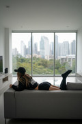 gemini-2-5-flash-image-Modern-apartment-in-background-Sofa-in-foreground-On-it-a-female-is-laid-ou