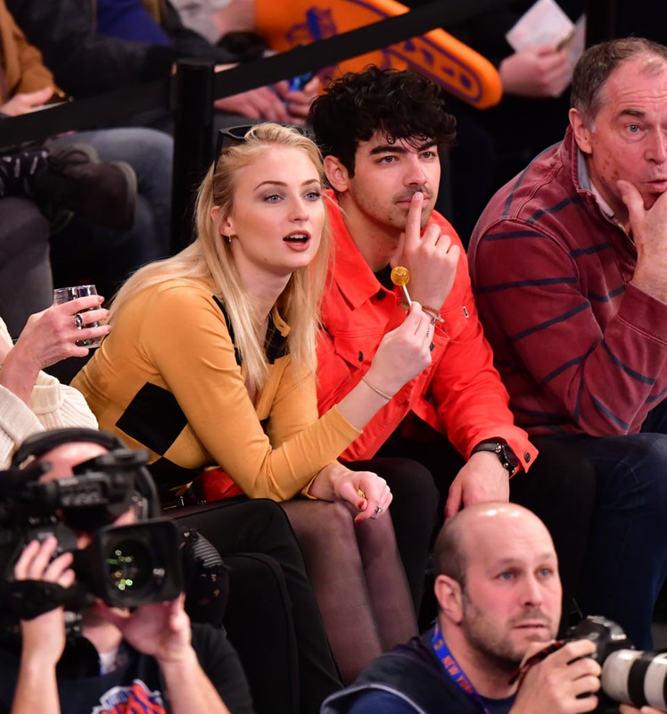 Sophie-Turner-Crossed-Legs-in-Pantyhose-Attend-sacramento-king