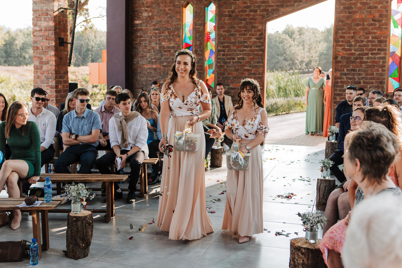 A close-up of a couple signing their wedding register.