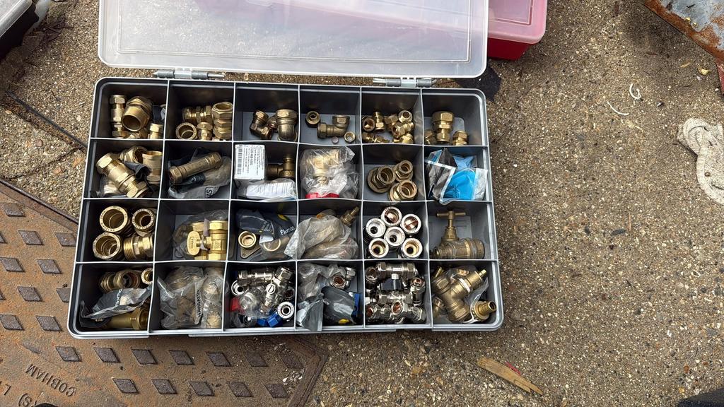 Organiser case of brass compression fittings and valves