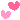 two pink hearts dancing