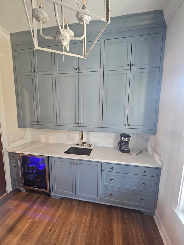 Tall built-in cabinetry with open shelves