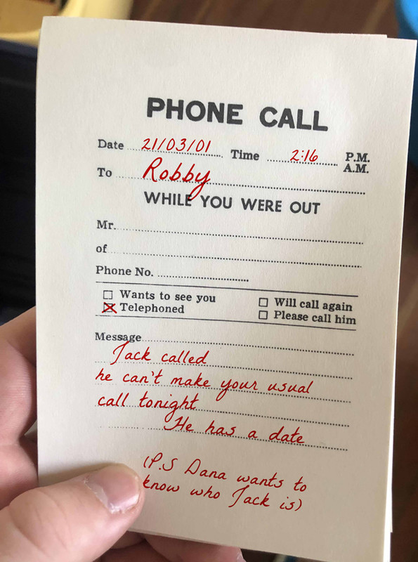 a message pad for missed phone calls. There is a message from Jack to Robby saying he can't make their regular Friday call because of a date. There is a message below from Dana wanting to know who Jack is