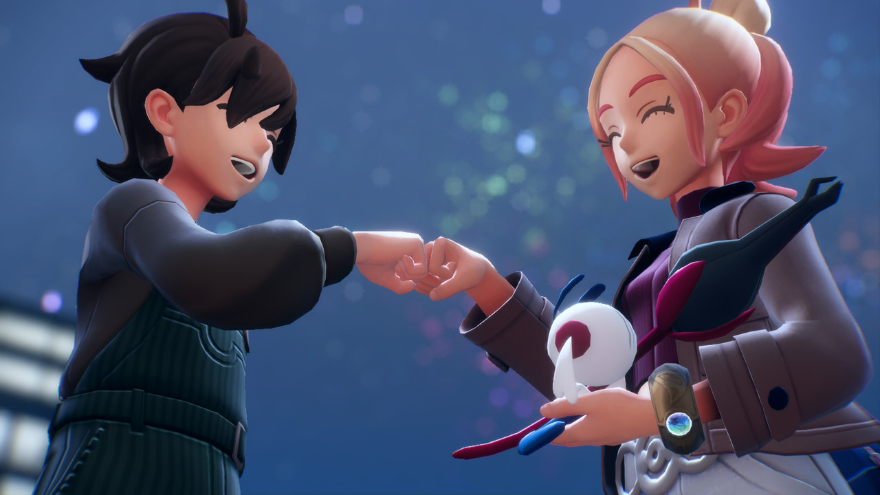 Tyler and Taunie fist bumping with Floette resting in Taunie's hand.