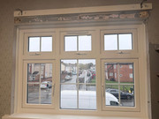 Window installation after - new triple-pane uPVC window with Georgian bars and swag-and-tail pelmet