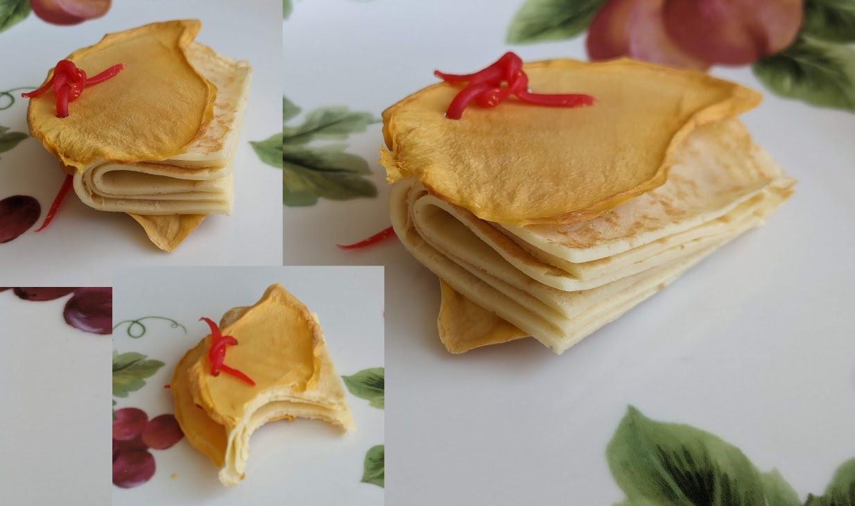 Dehydrated mango covers, crepe pages, pamphlet stitch with Twizzler. Very tasty!