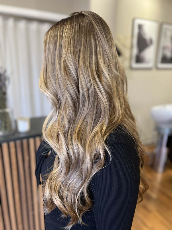 Customer with light brown hair and Balayage highlights