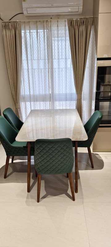 Technician installing dining table film