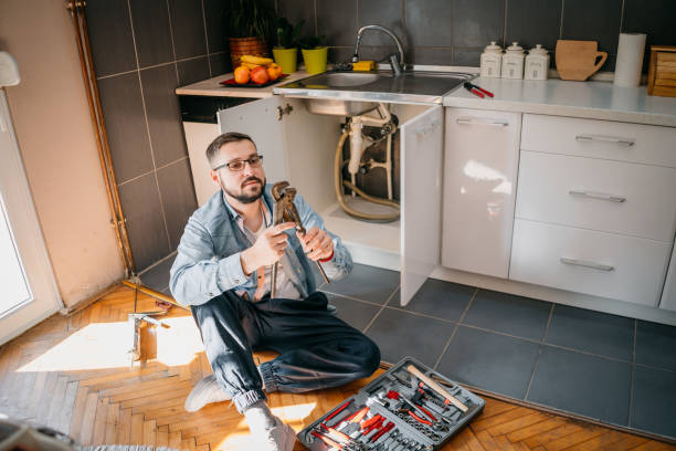 Expert plumber fixing pipe