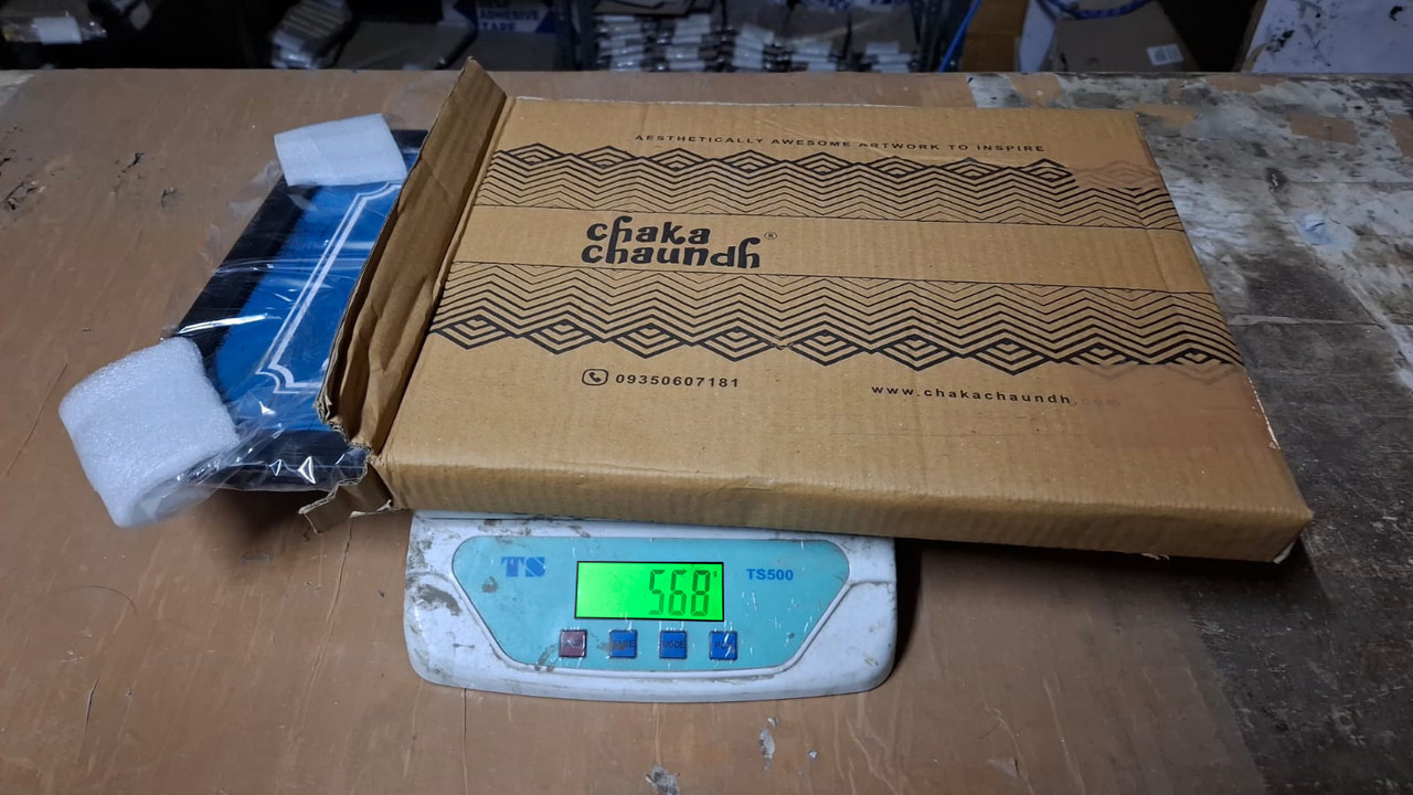 Image of weight of product with outer shipping box such that product is visible