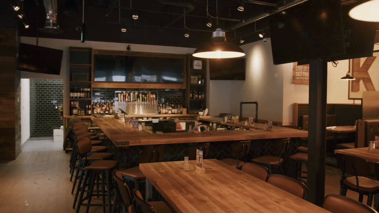 Finished Kelseys bar with tap wall, stools and communal tables