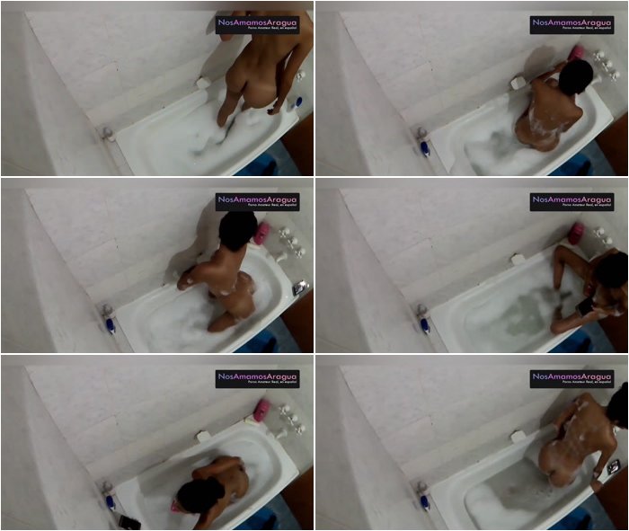 Sexy-tanned-girl-making-selfie-playing-with-toy-in-the-bathtub-3.jpg