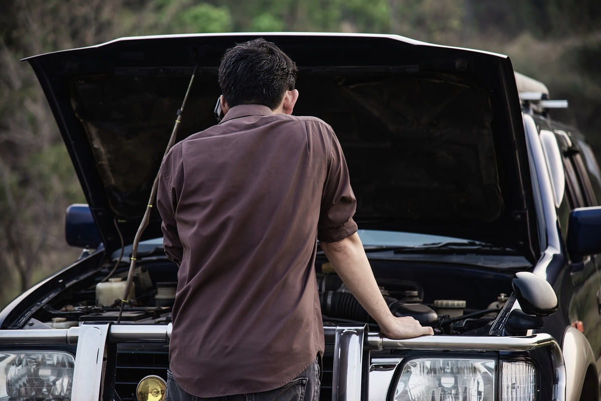 man-try-fix-car-engine-problem-local-road-3.jpg