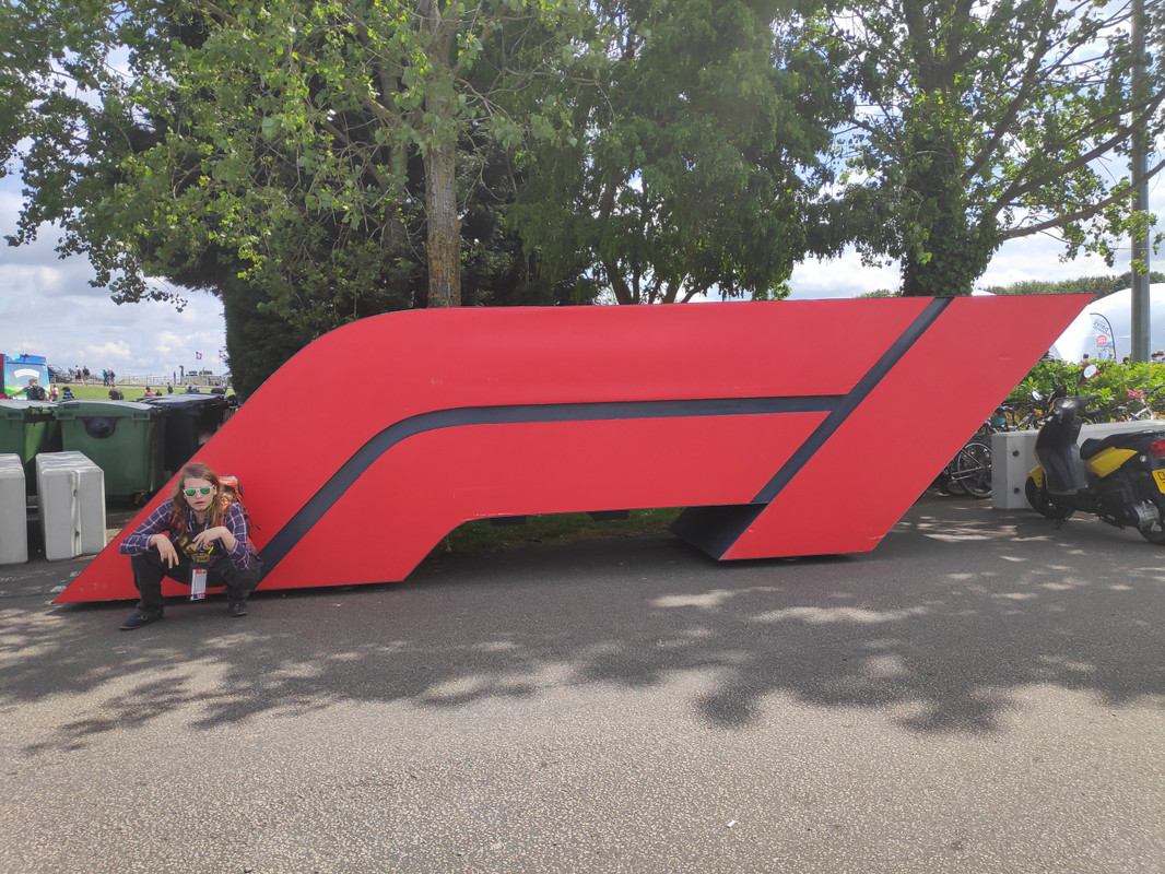 Chris posing in front of a giant F1 logo