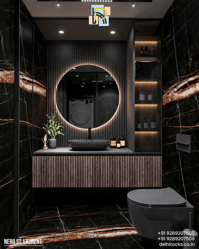 Nero St Laurent wraps this powder room in bold moody drama Deep black stone streaked with