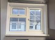 Loft window installation after - new white uPVC double-glazed window installed in loft bedroom