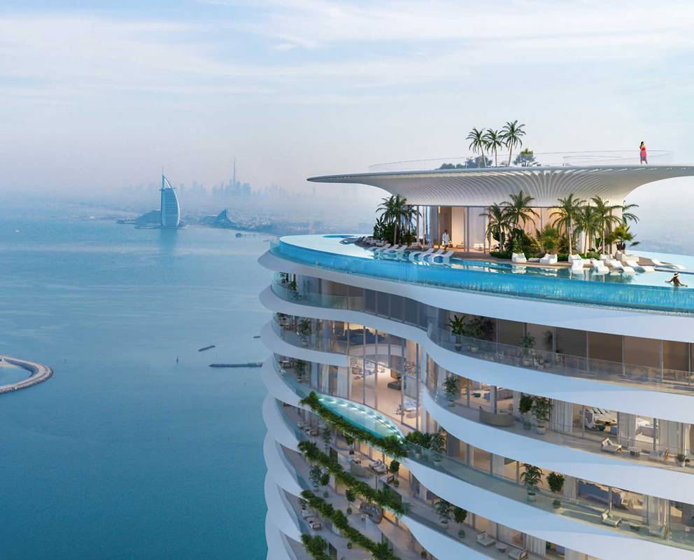 Como Residences Distress Deal luxury tower on Palm Jumeirah showcasing ultra-modern wave-inspired architecture with panoramic sea views and exclusive beachfront living in Dubai