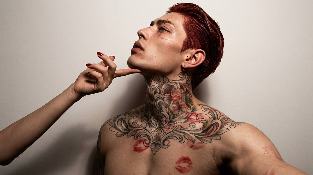 Man posing with kiss marks 202608171800