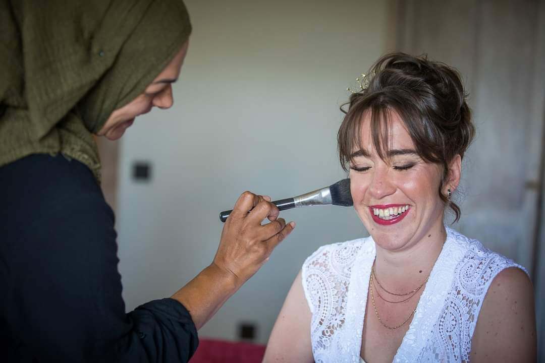 Bridal makeup application on wedding morning