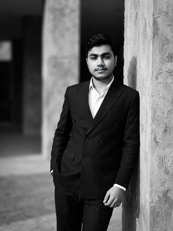 AI-generated example result for the creative-images prompt: Black Suit Urban Portrait by Prompt Craft