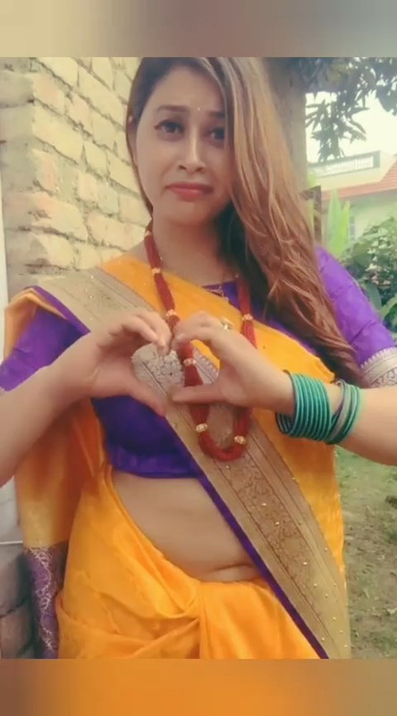 Beautiful Nepali Aunty Sexy open Big Deep Navel in Orange Saree.mp4_snapshot_00.11.038