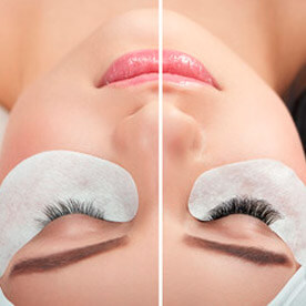 Woman with eyelash extensions, eyes closed.