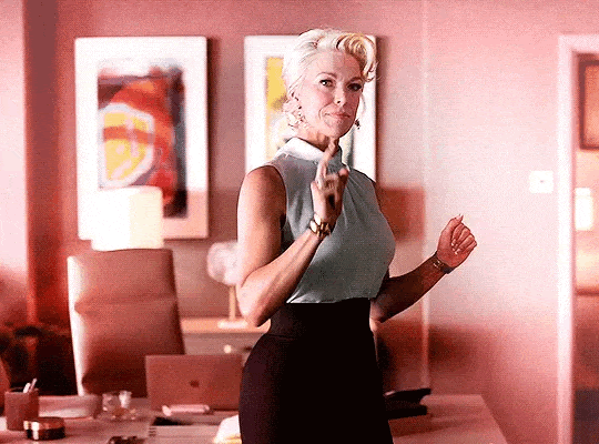 Rebecca punctuates the air with her pointer finger and says "Yes."