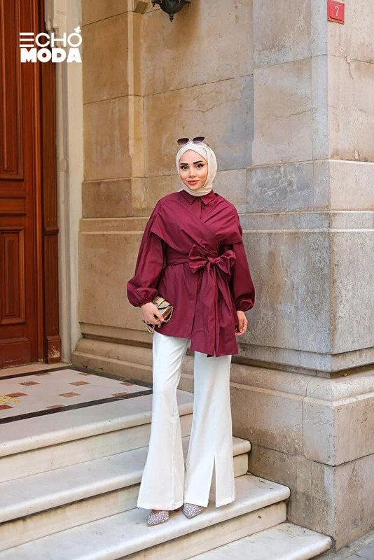 بلوزة طويلة بأكمام واسعة تجمع بين الراحة والستايل العصري للمحجبات. بلوزة طويلة بأكمام واسعة تجمع بين الراحة والستايل العصري للمحجبات.