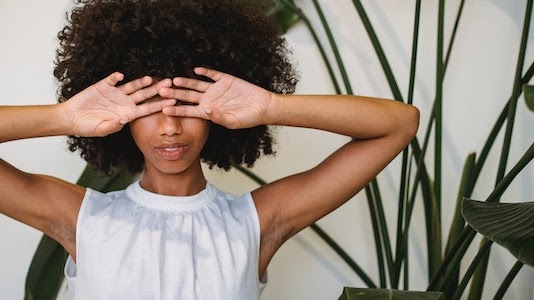 A girl hiding her face
