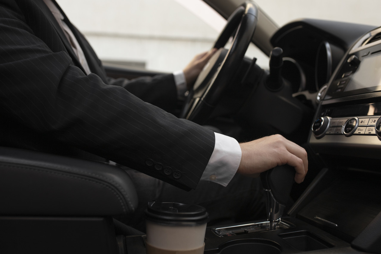 man using his car s options while driving