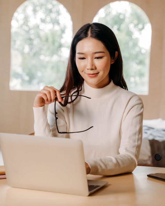 Woman practicing the skill of happiness with the Inner Wisdom Unlocked companion guide.