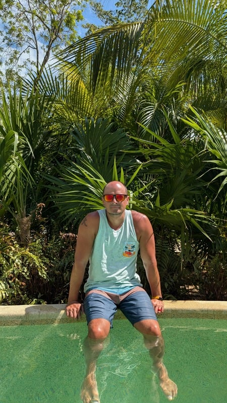 Travel advisor sitting by the pool