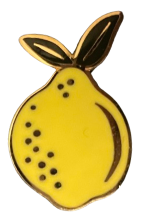 an enamel pin of a lemon