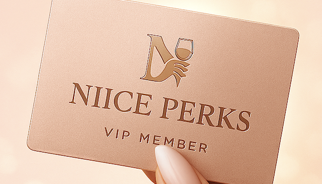 Niice membership cards stacked on a soft pink surface