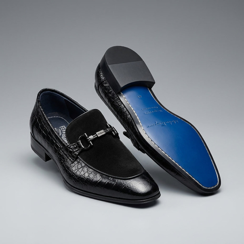 Premium Italian leather oxford shoes in dark brown on marble surface