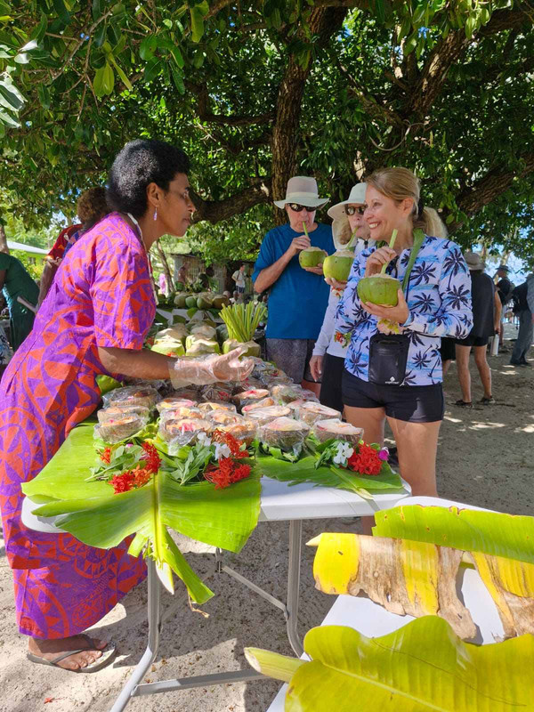 Tourists-enjoying-coconut-juice-bu-upon-entereing-Yasawa-i-rara-village